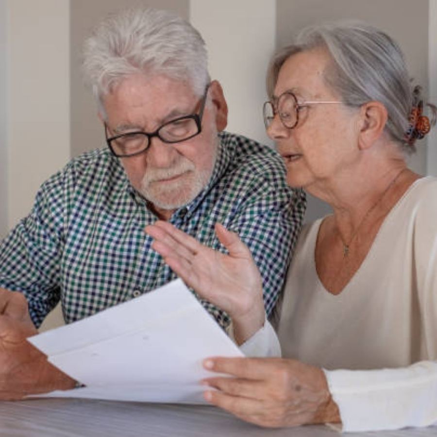 senior couple reviewing timeshare document