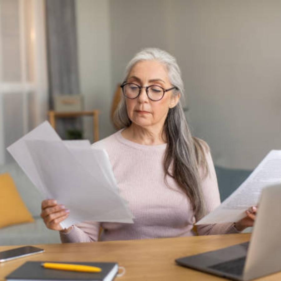 senior woman reviewing a timeshare contract