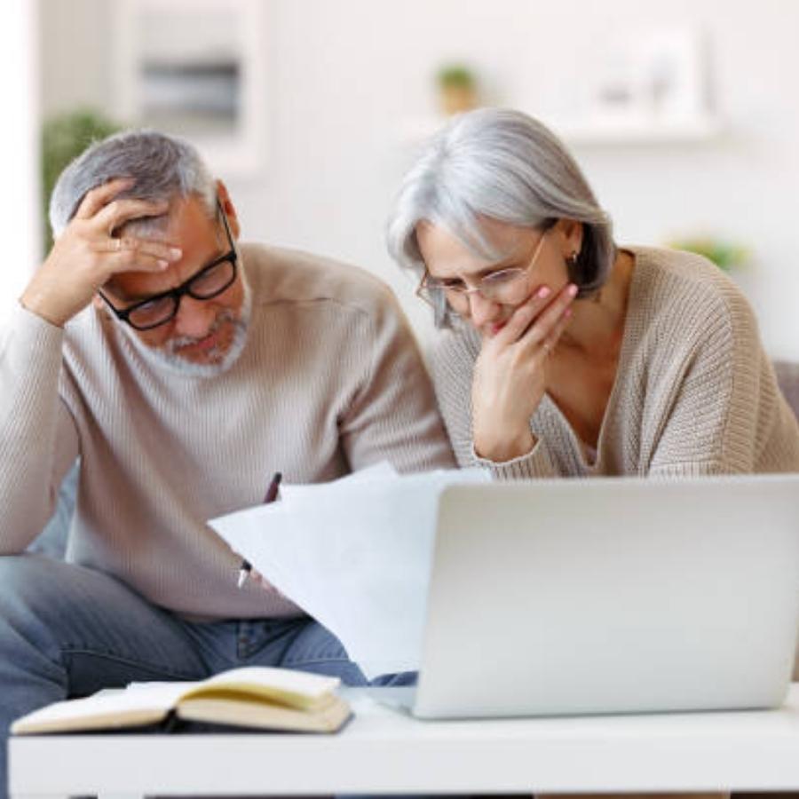 senior couple reviewing a timeshare cancellation contract
