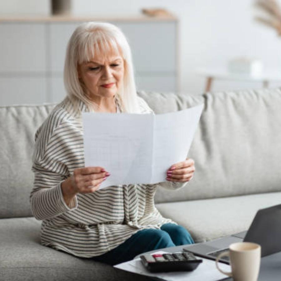 senior woman reviewing a timeshare contract