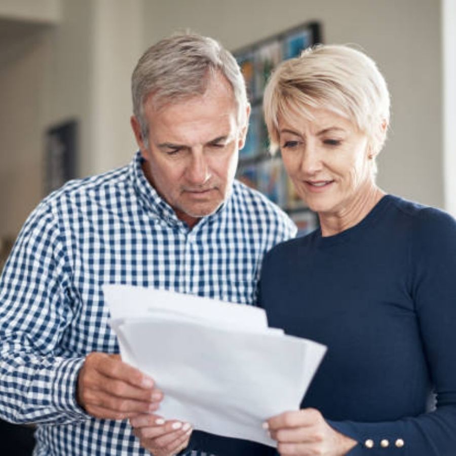 senior couple reviewing timeshare contract