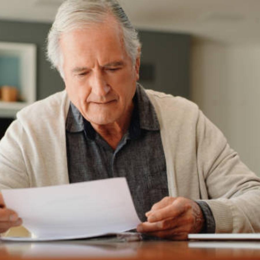 senior man reviewing a timeshare contract