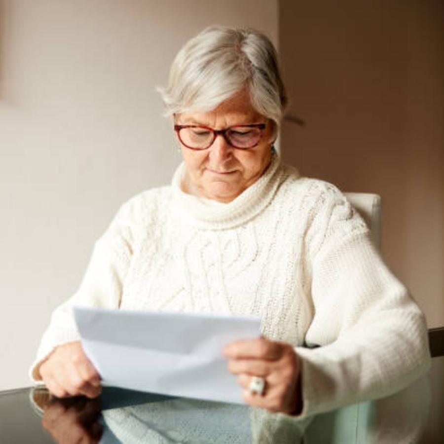 senior woman reviewing a timeshare contract