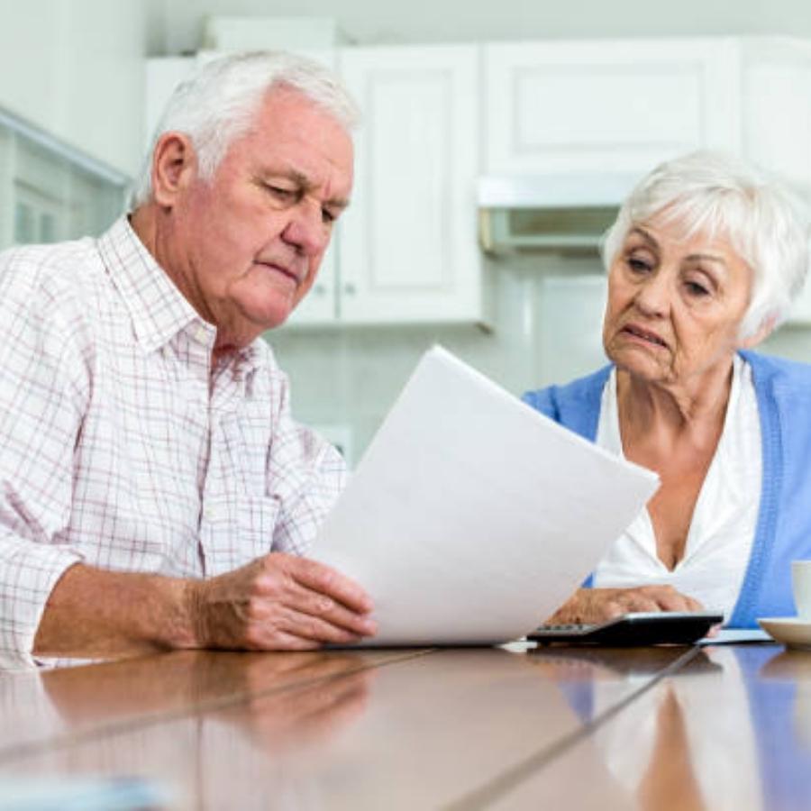 stressed senior couple reading timeshare cancellation contract