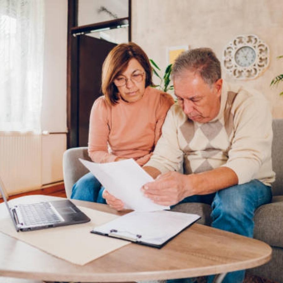 senior couple reviewing a timeshare cancellation contract