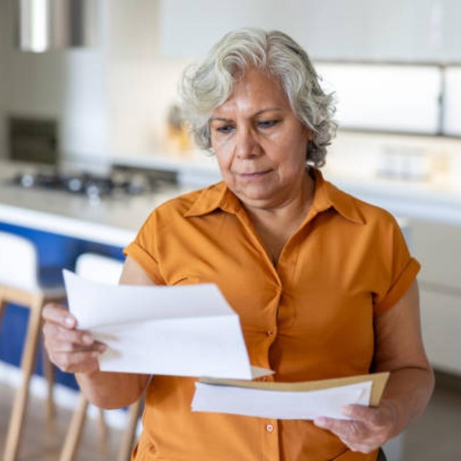 senior woman reviewing a timeshare contract
