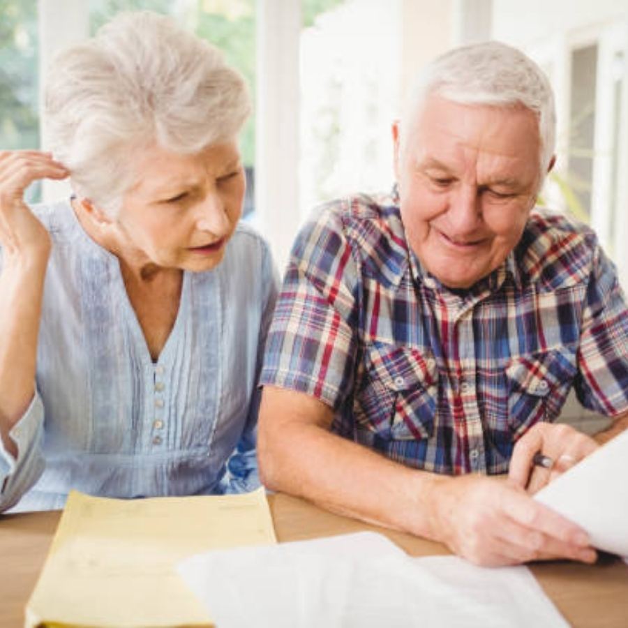 senior couple reviewing timeshare contract