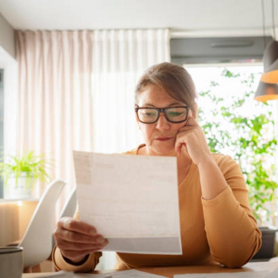 senior woman reviewing a timeshare contract