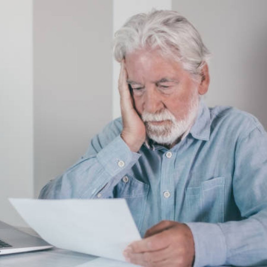 senior man reviewing timeshare contract