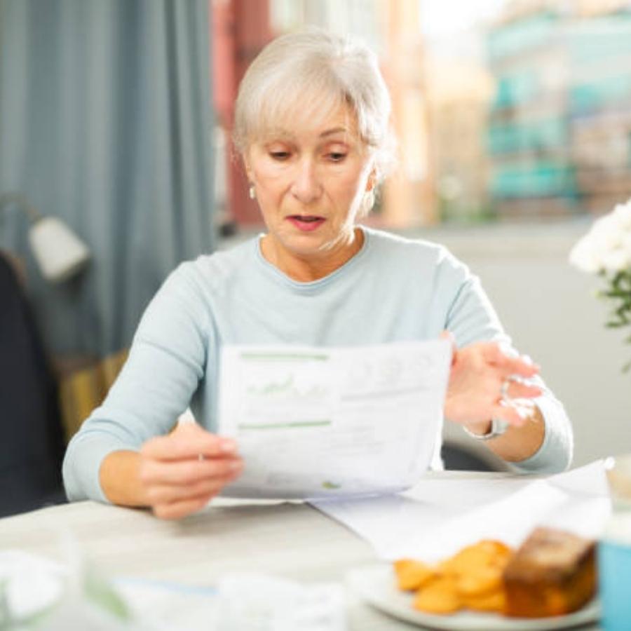 senior woman reviewing a timeshare contract