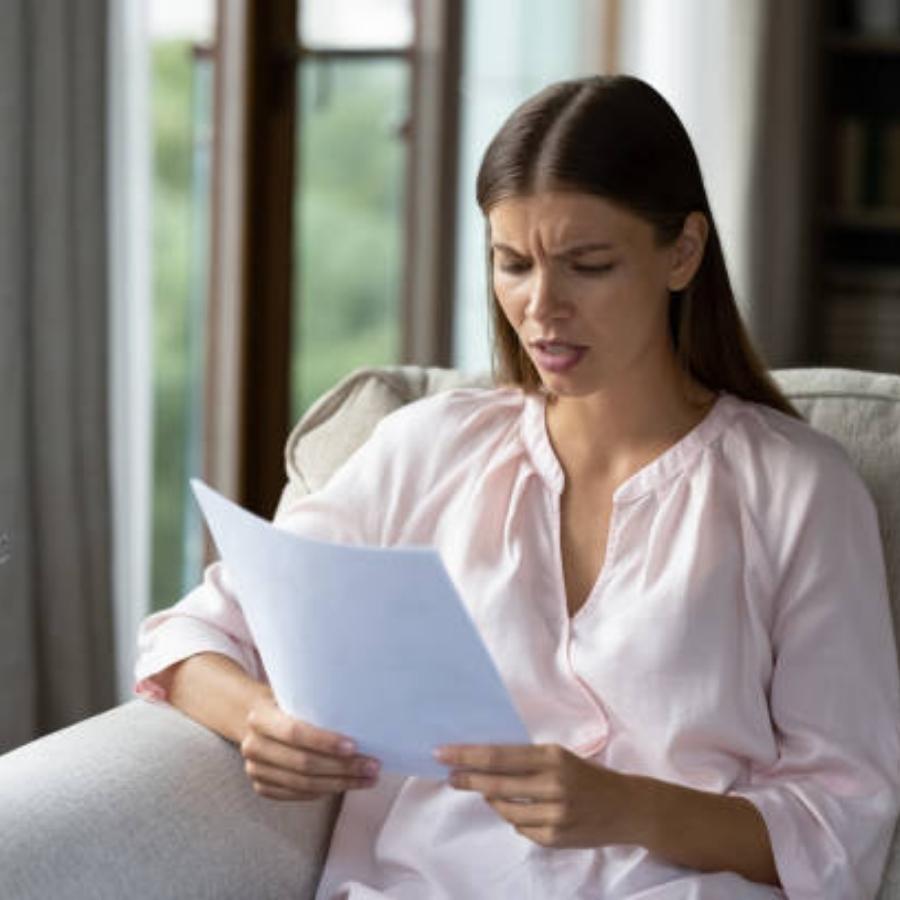 stressed woman reviewing a timeshare contract