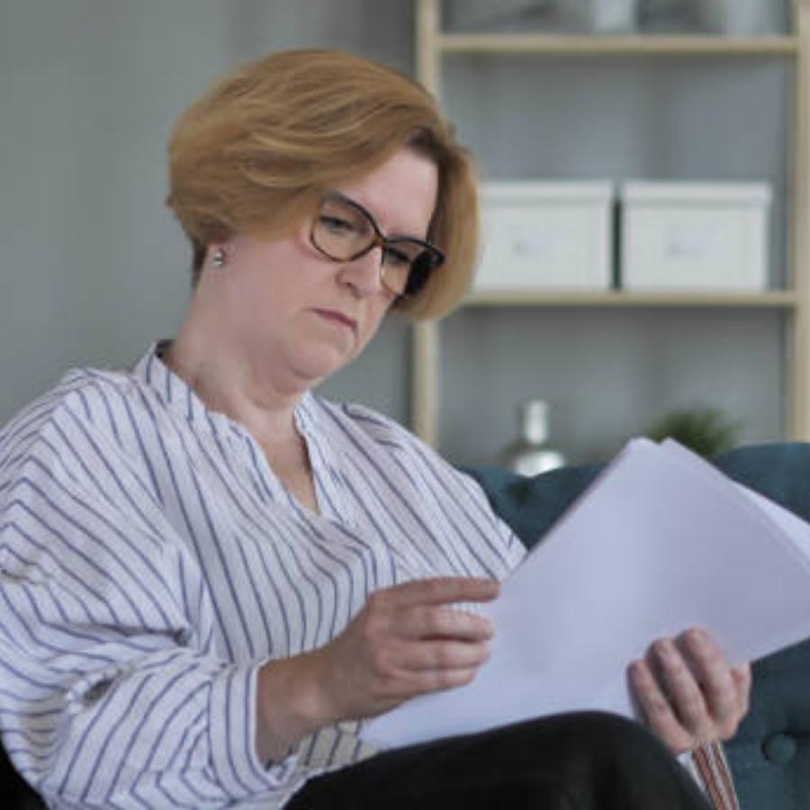senior woman reviewing a timeshare contract