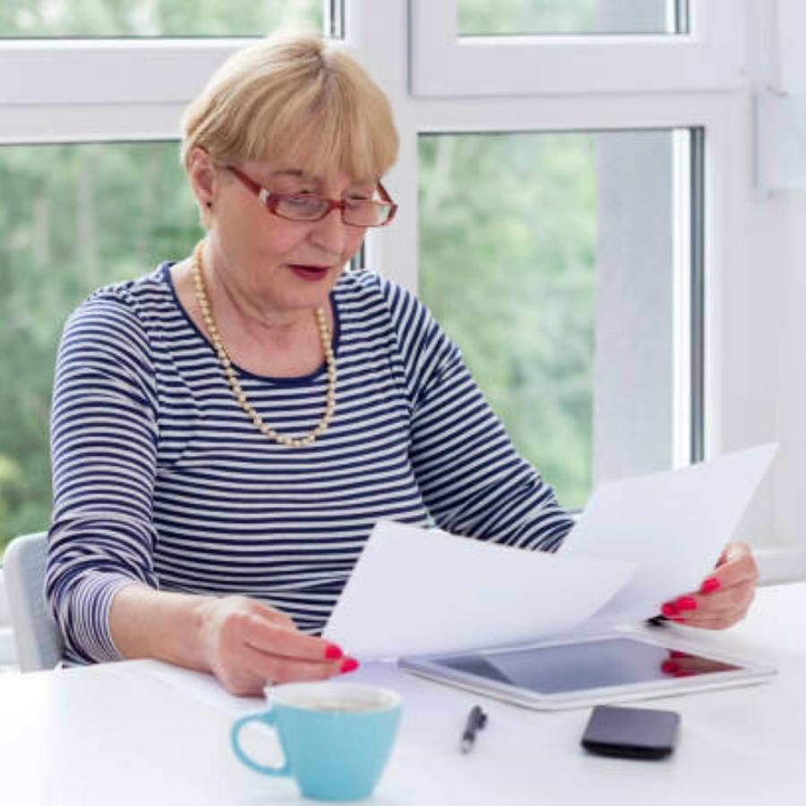 senior woman reviewing a timeshare contract