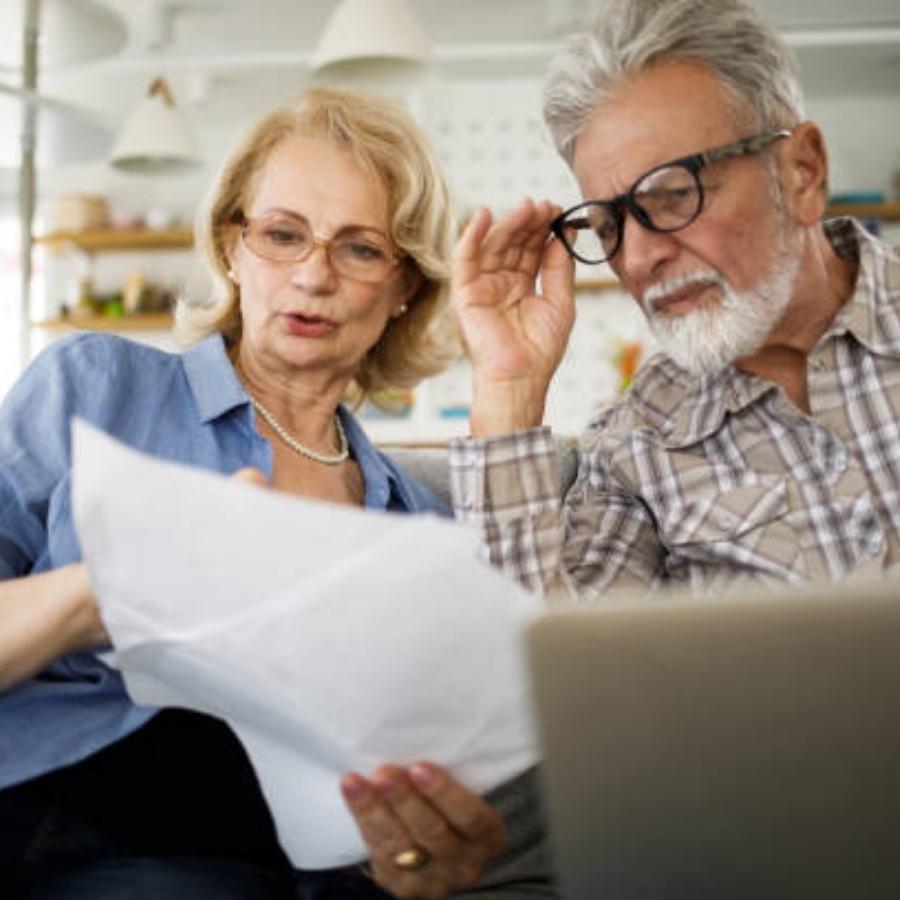 senior couple reviewing a timeshare cancellation contract