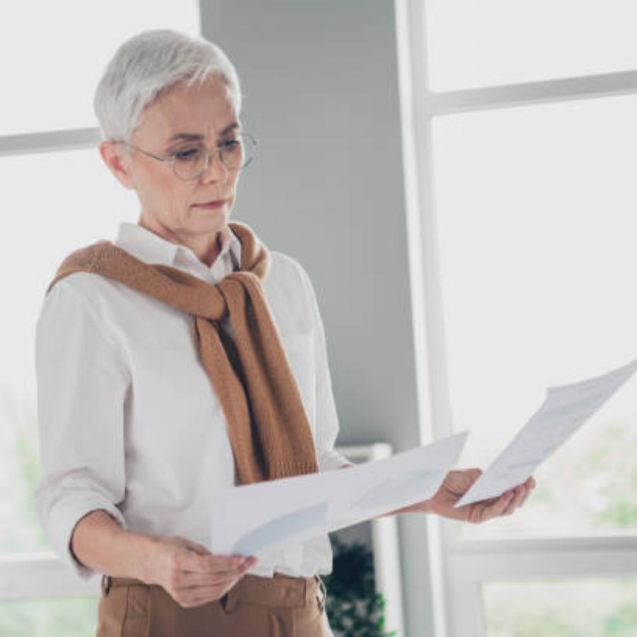 senior woman reviewing a timeshare contract