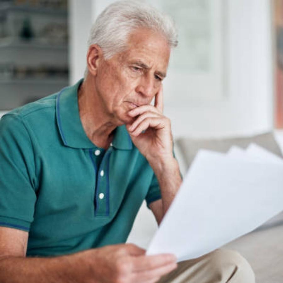 senior man reviewing a timeshare contract