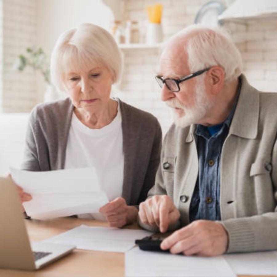 senior couple reviewing a timeshare cancellation contract