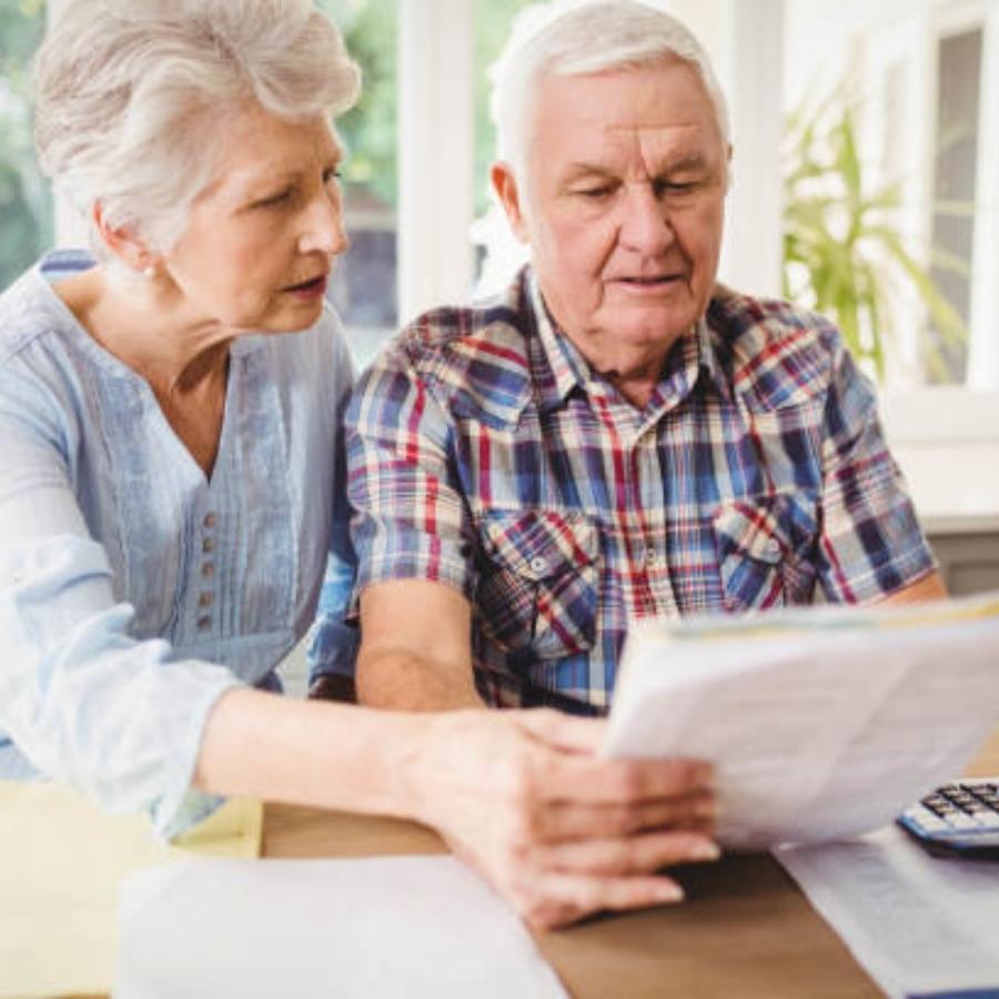 stressed senior couple reviewing a timeshare cancellation