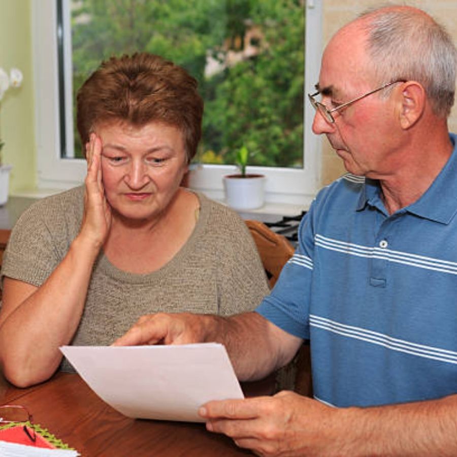 senior couple reviewing timesahre contract