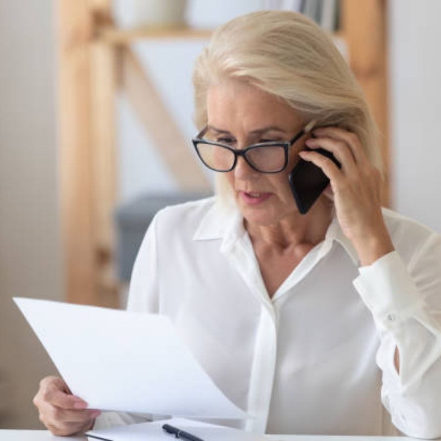 senior woman stressed in timeshare contract