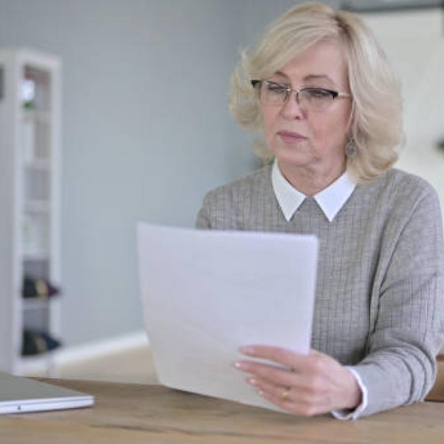 senior woman reviewing a timeshare contract