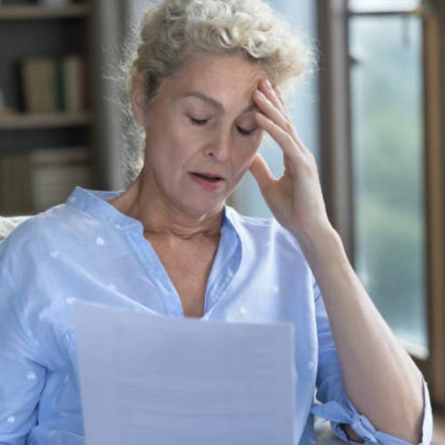 senior woman reviewing a timeshare contract