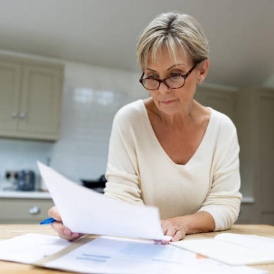 senior woman reviewing a timeshare contract