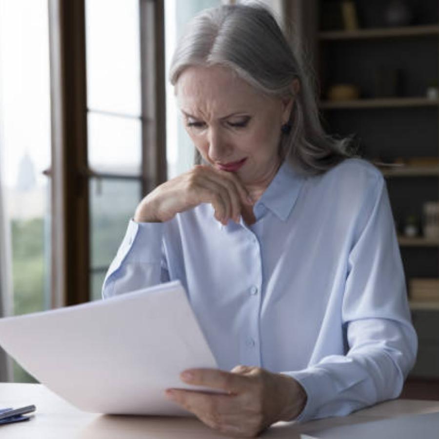 senior woman reviewing timeshare contract