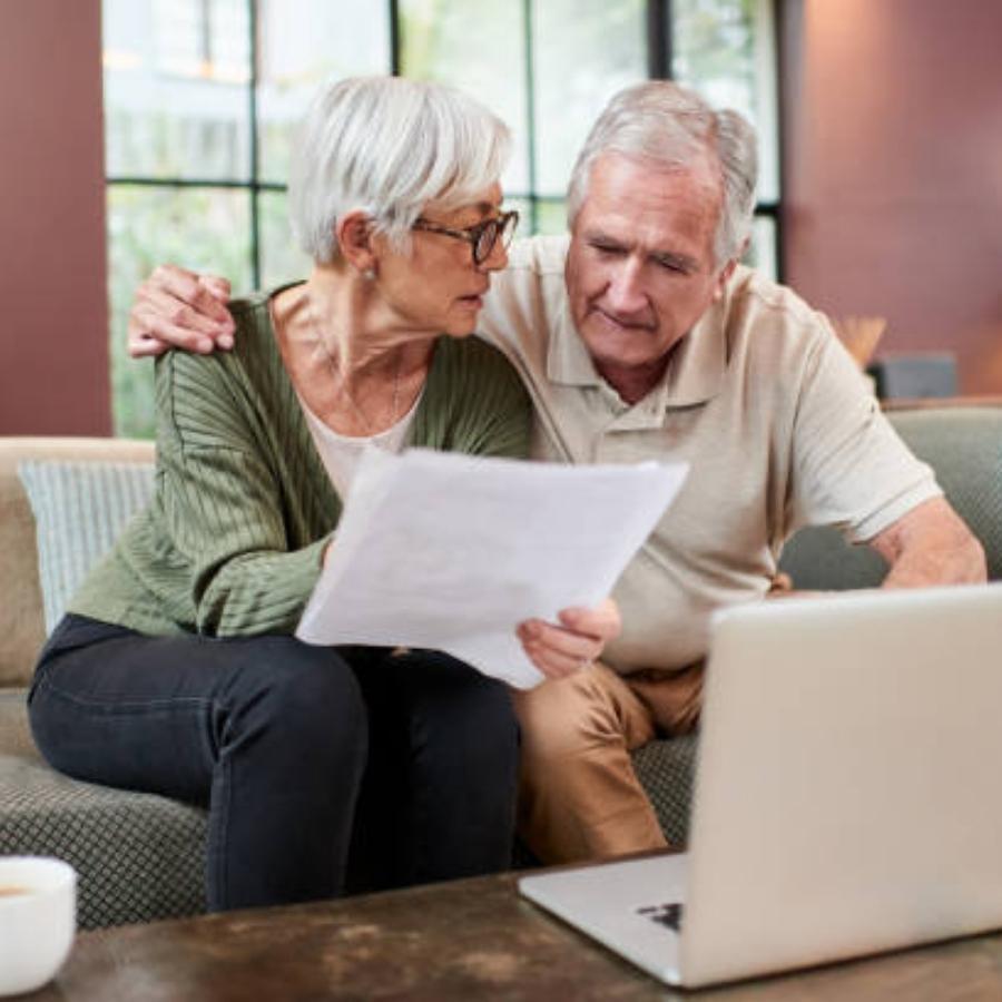 stressed senior couple reviewing a timeshare cancellation contract