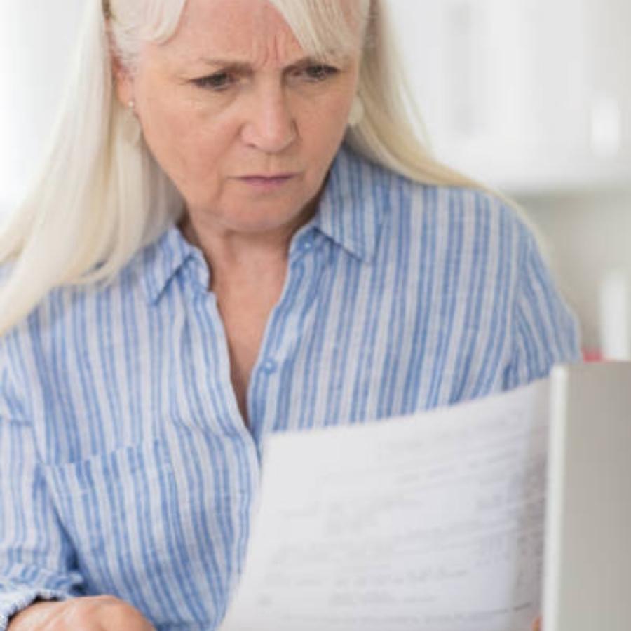 senior woman reviewing a timeshare contract