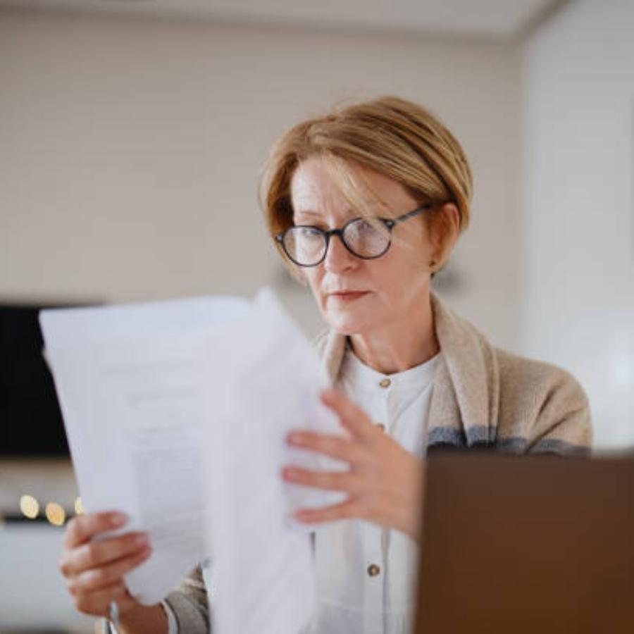 senior woman reviewing a timeshare contract