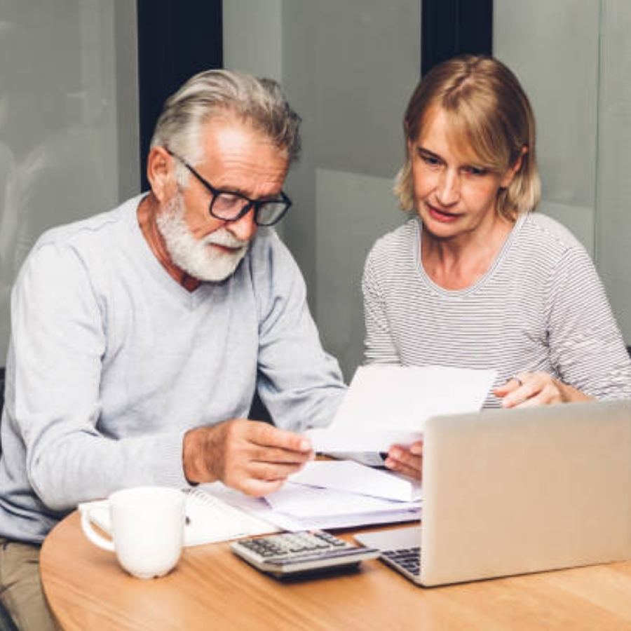 senior couple reviewing timeshare contract