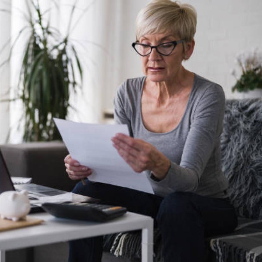 senior woman reviewing timeshare contract