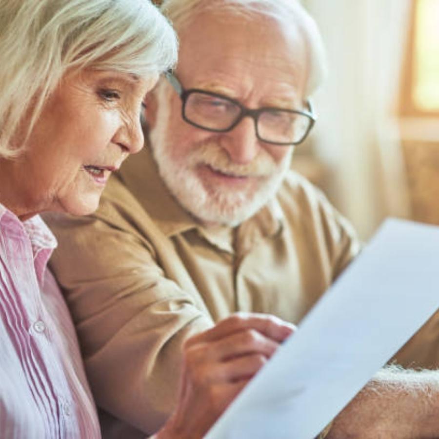 senior couple reviewing a timeshare cancellation contract