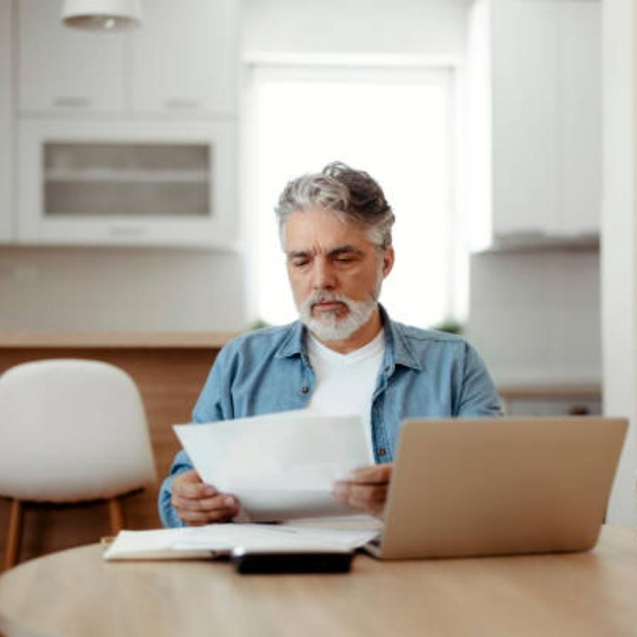 senior man reviewing a timeshare contract