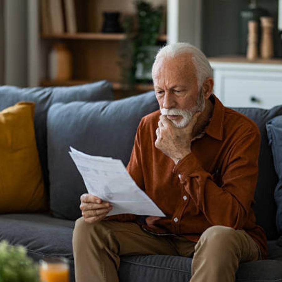 senior man reviewing a timeshare contract