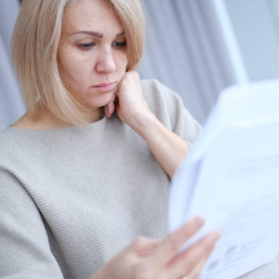 senior woman reviewing a timeshare contract