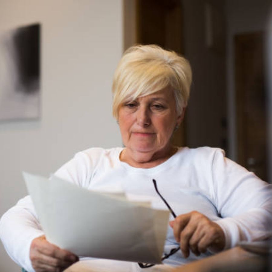 senior woman reviewing timeshare contract