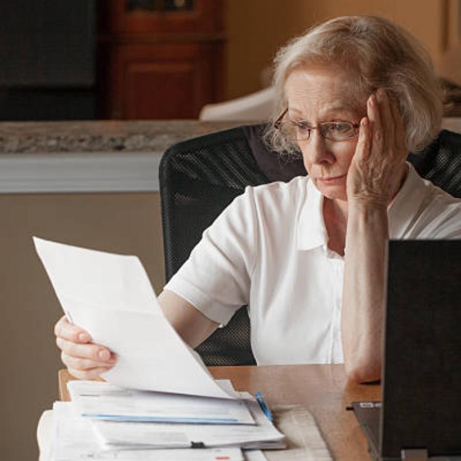 senior woman reviewing timeshare contract