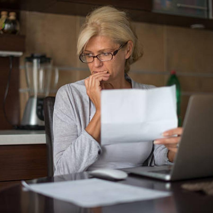 senior woman reviewing a timeshare contract