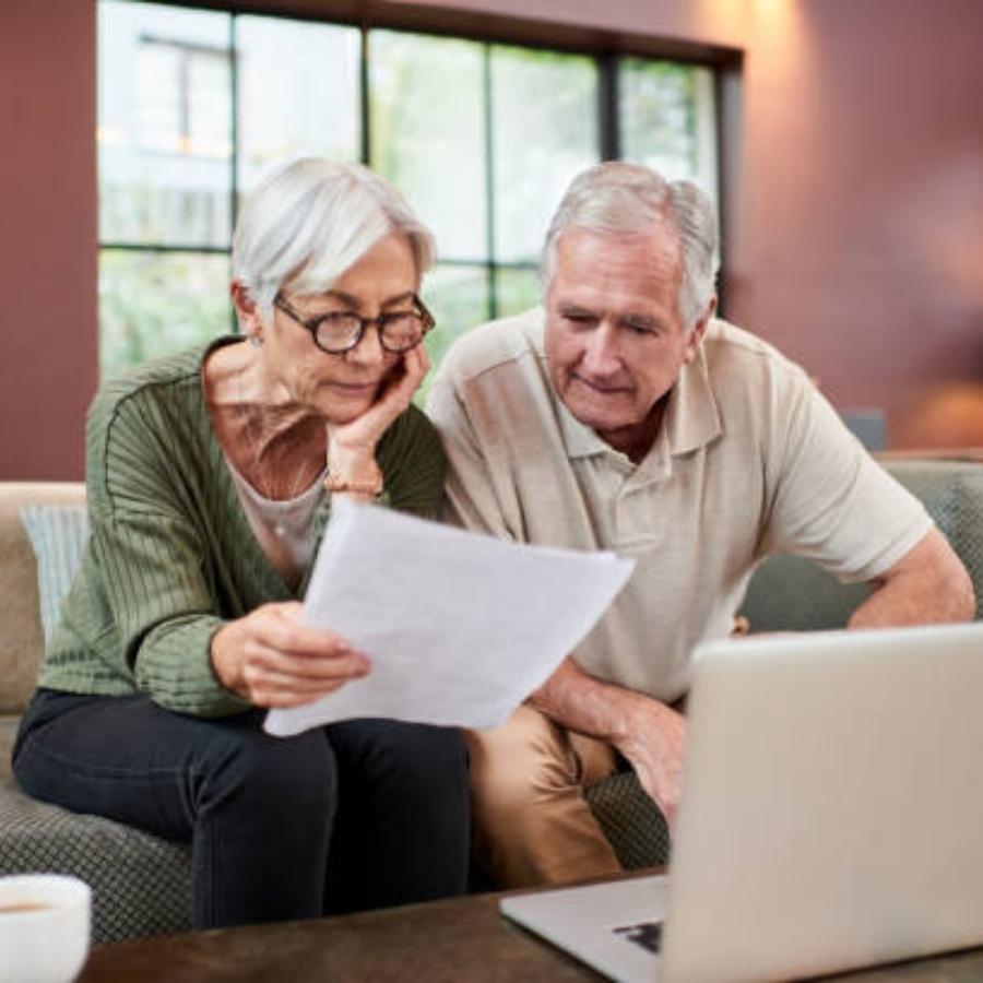 stressed elder couple reviewing timeshare cancellation contract
