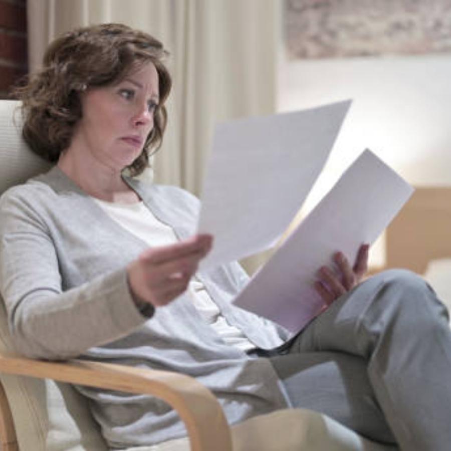stressed woman reviewing a timeshare contract