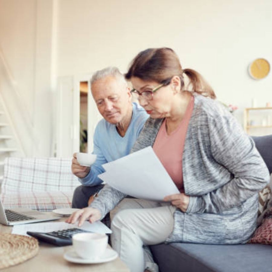 senior couple reviewing timeshare contract