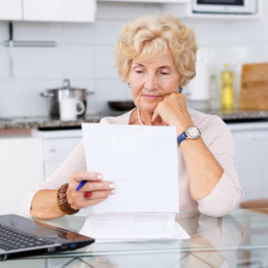 senior woman reviewing a timeshare contract