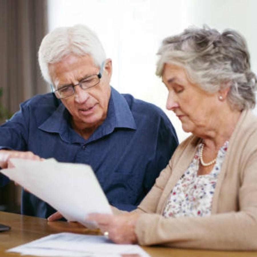 stressed senior couple reading timeshare cancellation contract