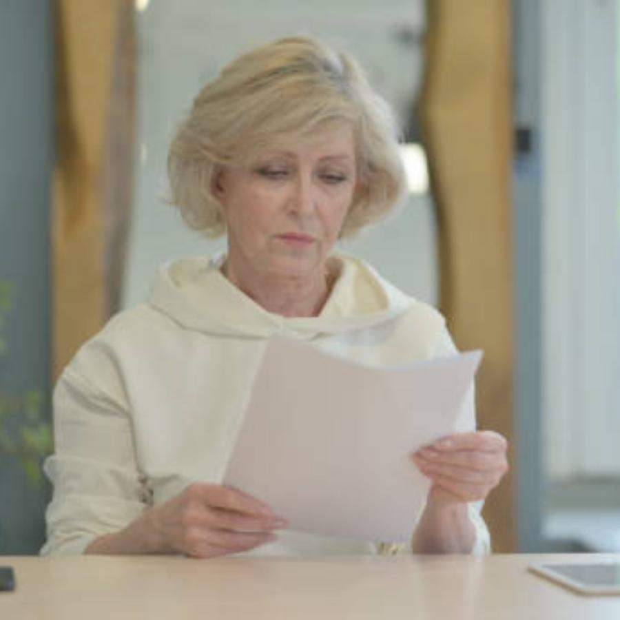 senior woman reviewing a timeshare contract