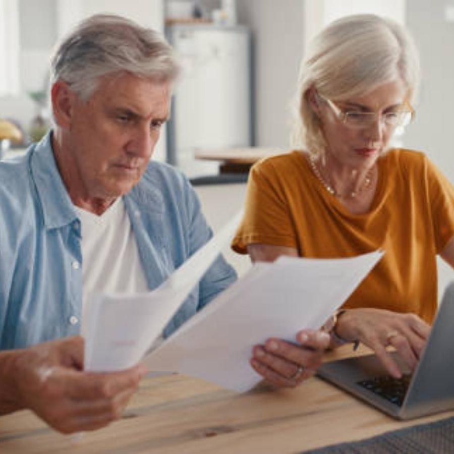 senior couple reviewing a timeshare cancellation contract