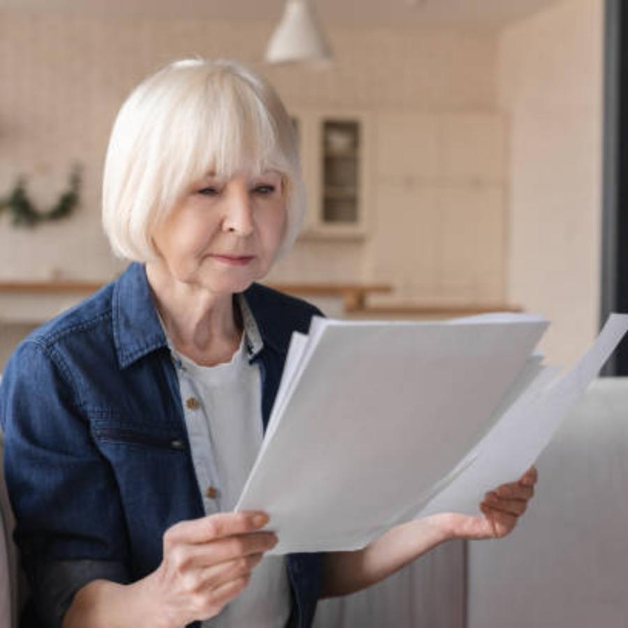 senior woman reviewing a timeshare contract