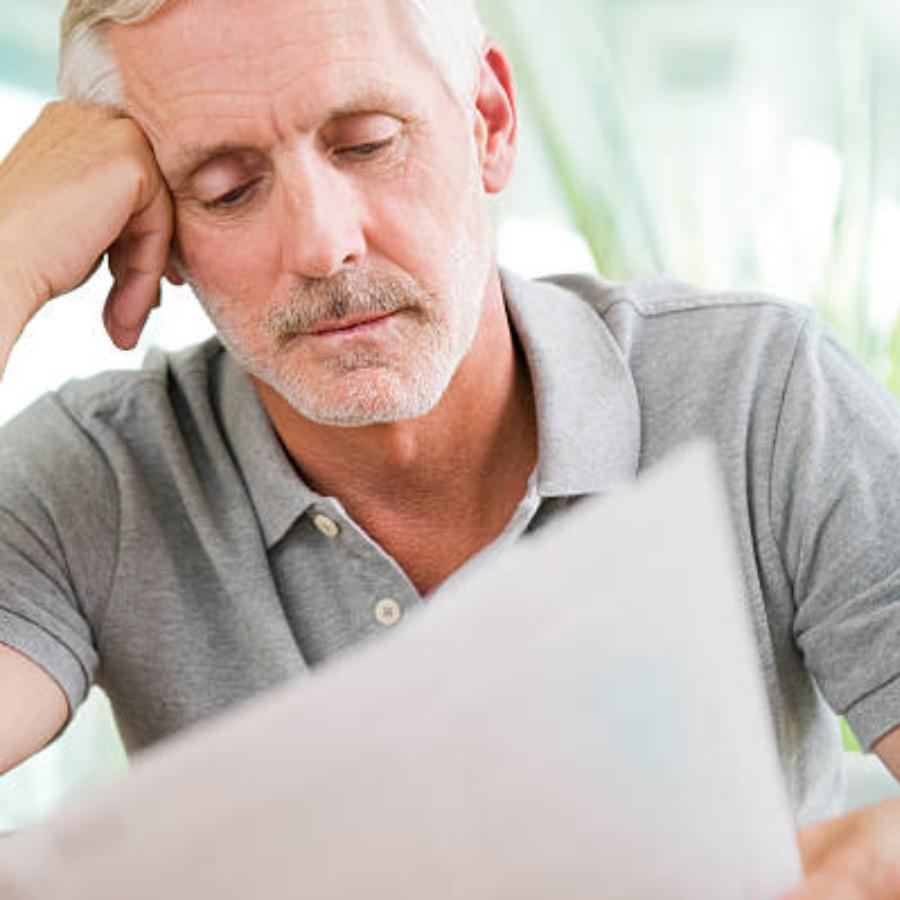 senior man reviewing a timeshare contract