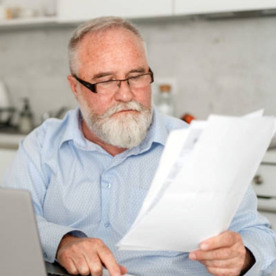 senior man reviewing timeshare contract